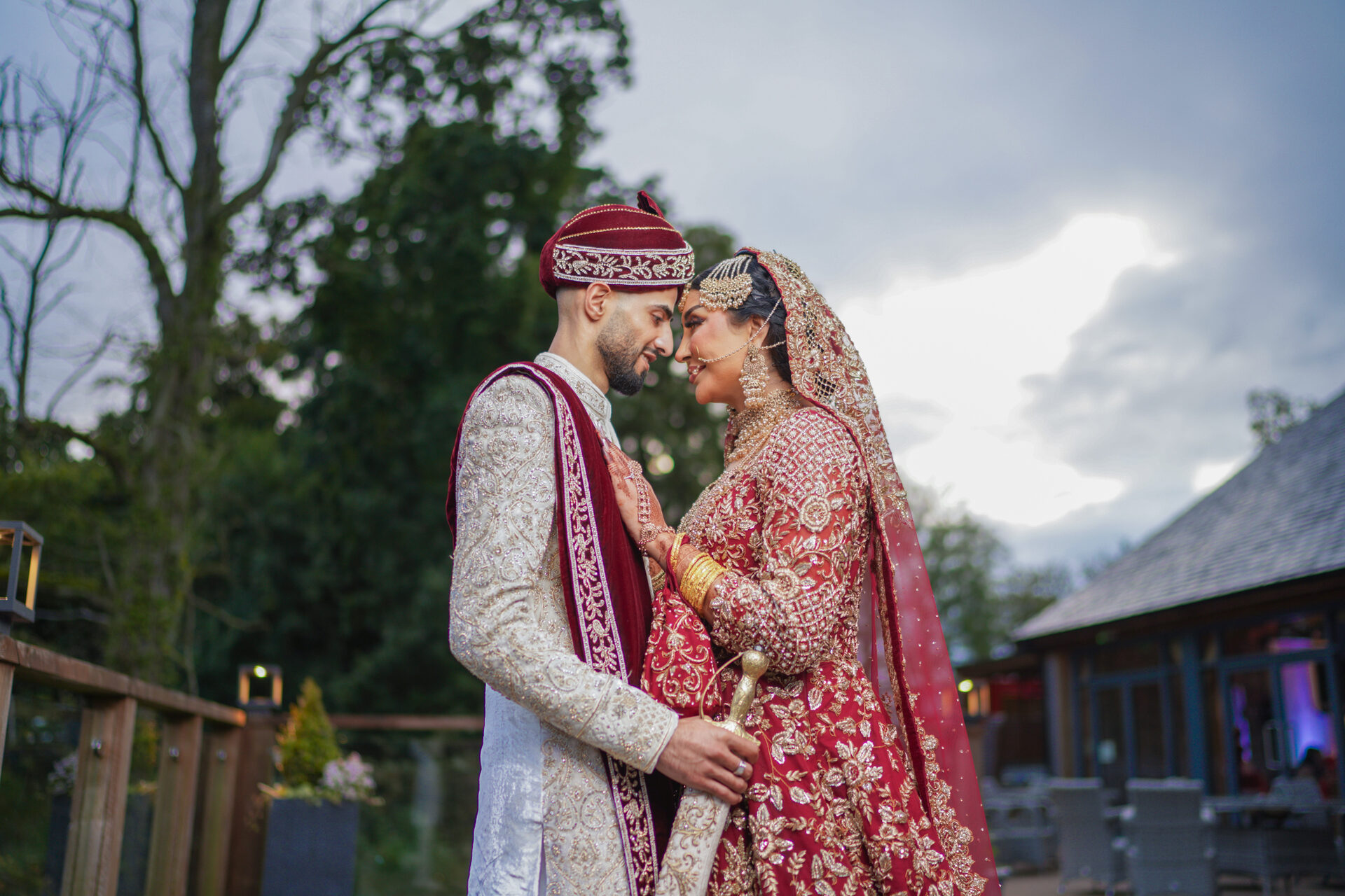 Wedding cinematography still - romantic couple portrait at golden hour